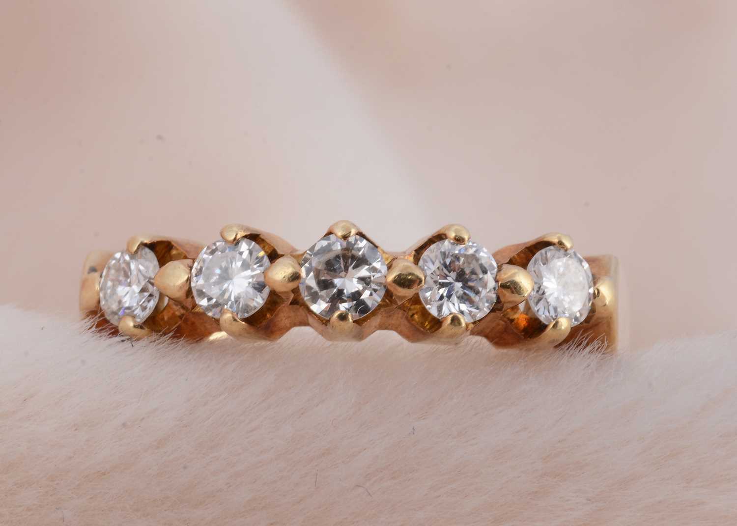 Lot 94 - A five stone yellow gold diamond dress ring