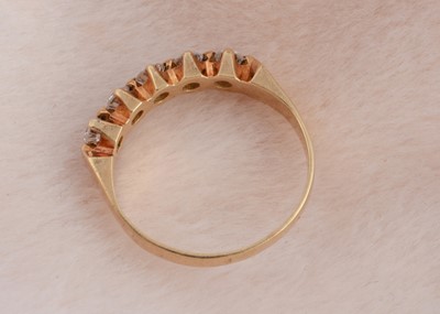 Lot 94 - A five stone yellow gold diamond dress ring