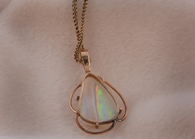 Lot 97 - A 9ct gold opal drop pendant and chain