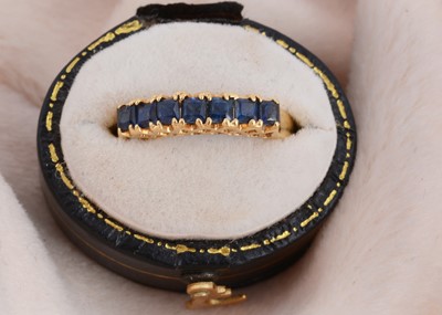 Lot 98 - An 18ct gold seven stone sapphire dress ring