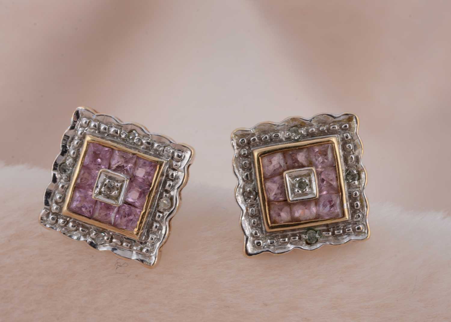 Lot 102 - A pair of amethyst and diamond square shaped stud earrings in 9ct gold