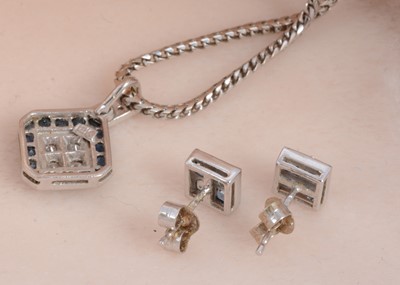 Lot 105 - An 18ct gold sapphire and diamond lozenge shaped pendant