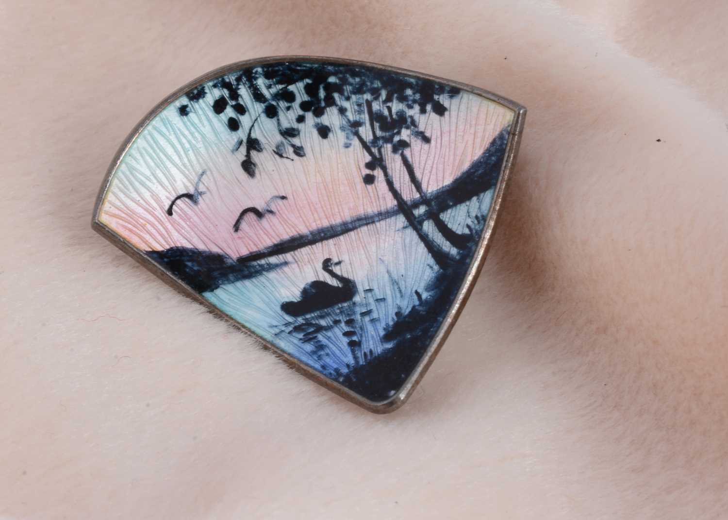 Lot 111 - A Norwegian silver and enamel triangular shaped brooch