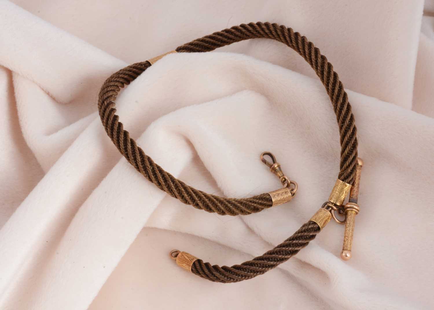 Lot 123 - A 19th Century hair and pinchbeck albert