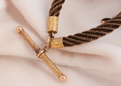 Lot 123 - A 19th Century hair and pinchbeck albert