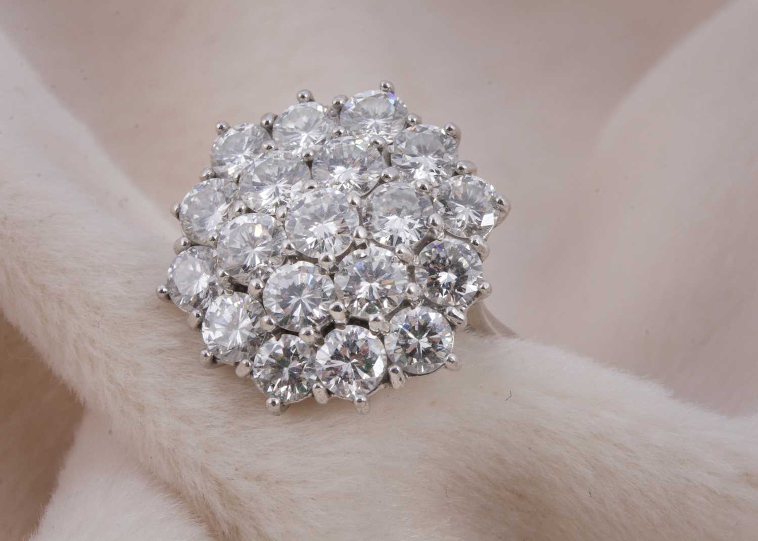 Lot 126 - A large continental white gold diamond cluster dress ring