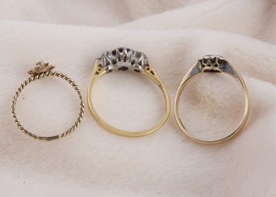 Lot 130 - An 18ct gold and platinum set three stone amethyst and diamond dress ring