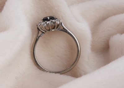 Lot 142 - A sapphire and diamond cluster ring