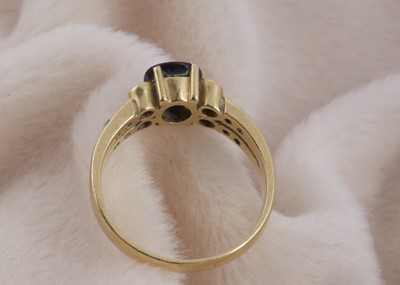 Lot 143 - An 18ct gold sapphire and diamond dress ring