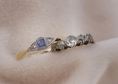 Lot 149 - A five stone 18ct gold and platinum set dress ring