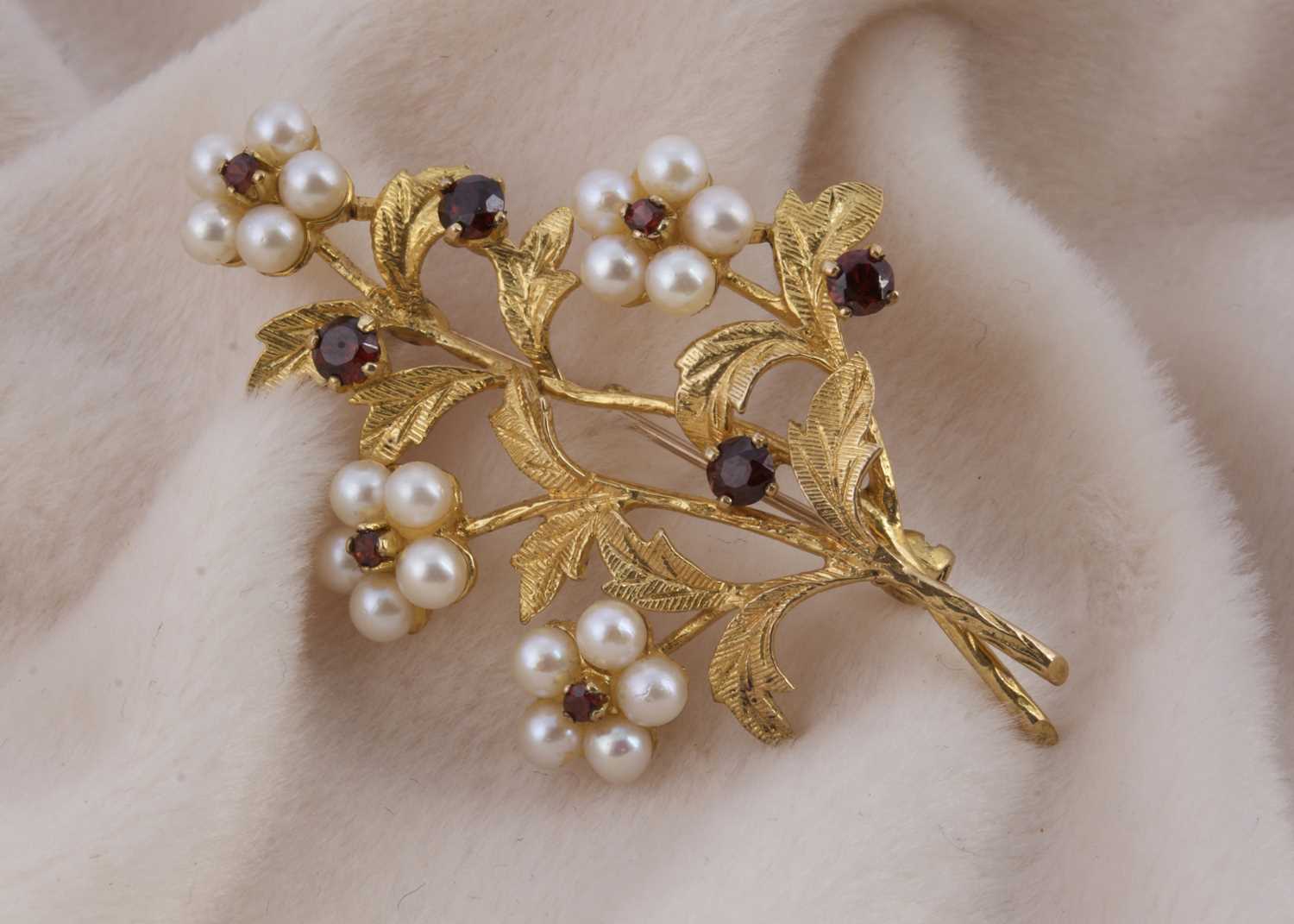 Lot 150 - A 9ct gold garnet and pearl floral brooch