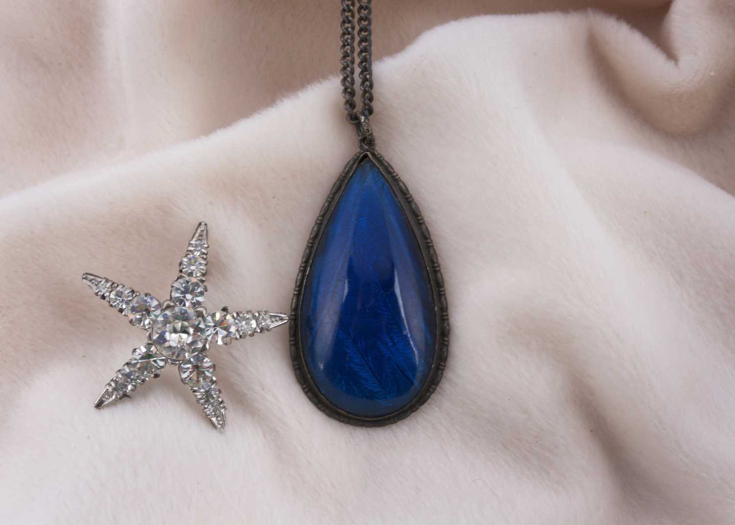 Lot 156 - A paste and silver set five pointed star brooch