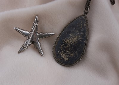 Lot 156 - A paste and silver set five pointed star brooch