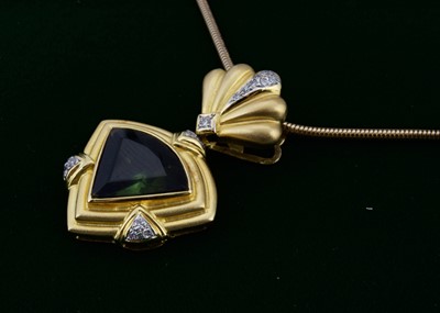 Lot 160 - An 18ct gold diamond and tourmaline pendant and chain
