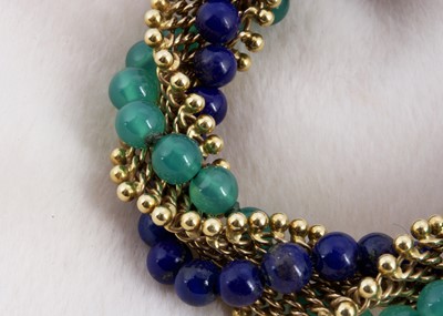 Lot 161 - An 18ct gold lapis lazuli and green chalcedony twist bracelet