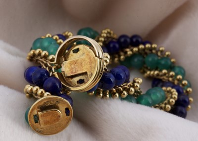 Lot 161 - An 18ct gold lapis lazuli and green chalcedony twist bracelet