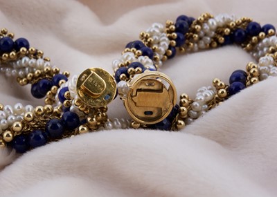 Lot 162 - A Van Cleef & Arpels 18ct gold seed pearl and lapis lazuli twist necklace