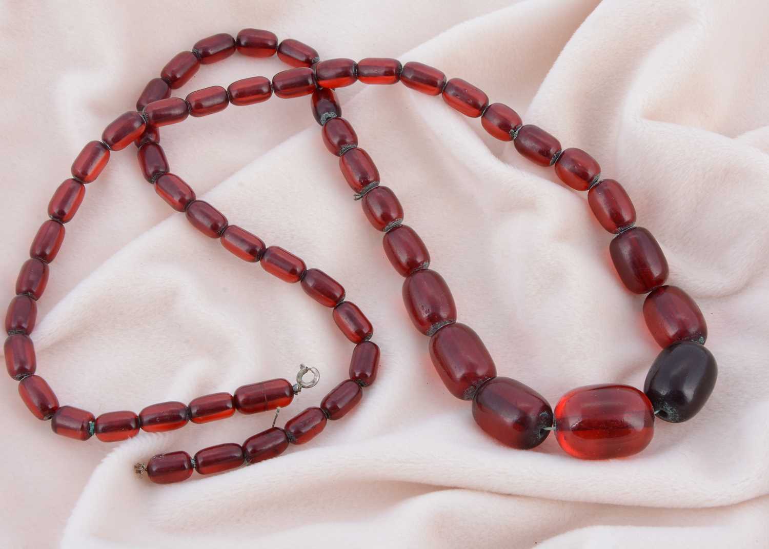 Lot 168 - A large graduated string of 'cherry' beads