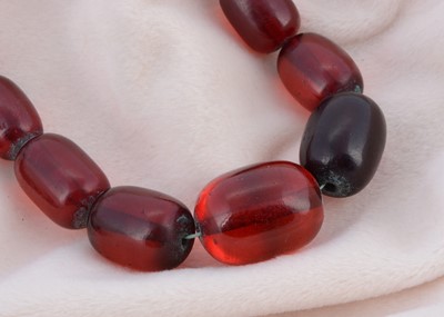 Lot 168 - A large graduated string of 'cherry' beads