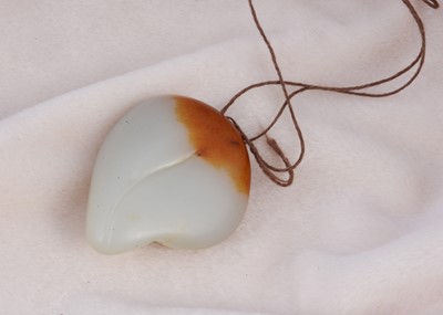 Lot 170 - A Chinese jadeite jade carved boulder pendant