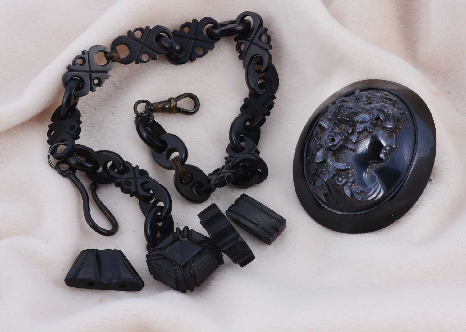 Lot 181 - A 19th Century carved jet fob chain