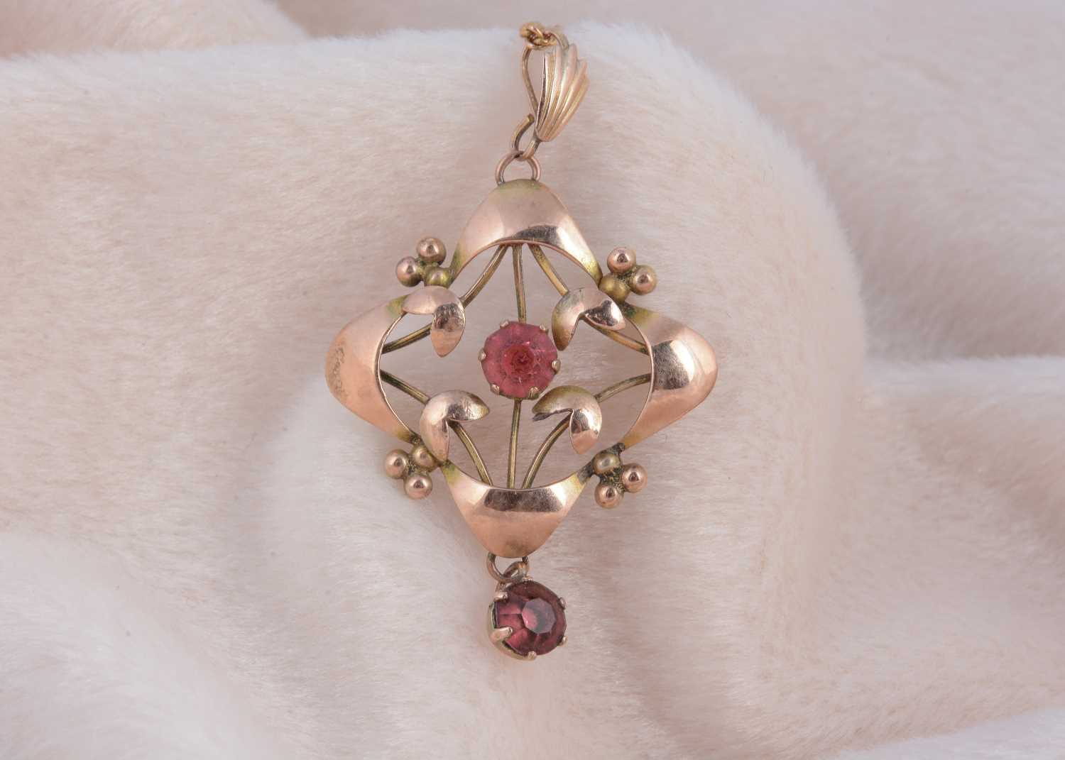 Lot 184 - An art nouveau 9ct gold paste set pierced pendant