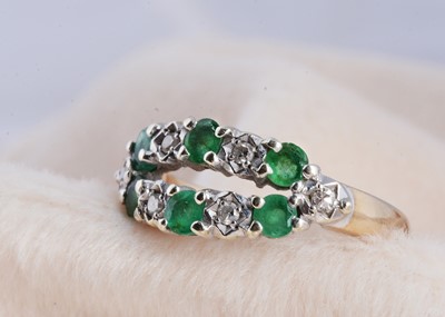 Lot 195 - A 9ct gold emerald and diamond boat shaped dress ring