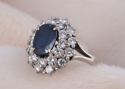 Lot 202 - A continental white gold sapphire and diamond set cluster ring