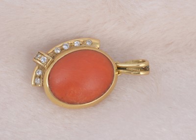 Lot 219 - A continental coral and diamond set oval pendant