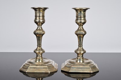 Lot 243 - A pair of late Victorian silver filled candlesticks by Thomas Bradbury & Sons