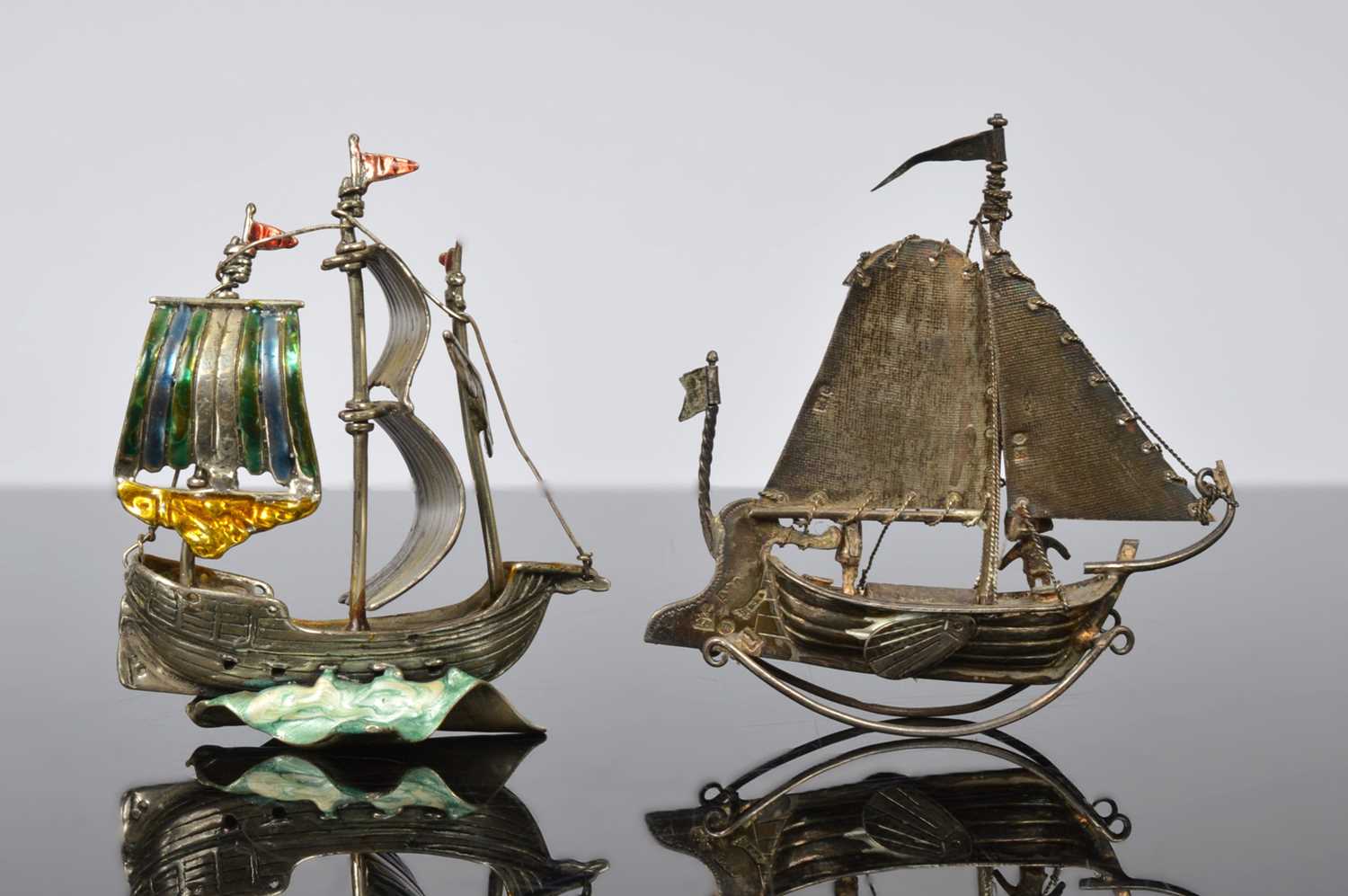 Lot 248 - Two small silver models of boats,
