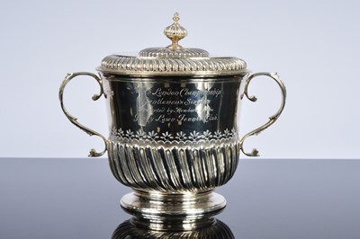 Lot 257 - A George V silver twin handled covered trophy cup from Mappin & Webb