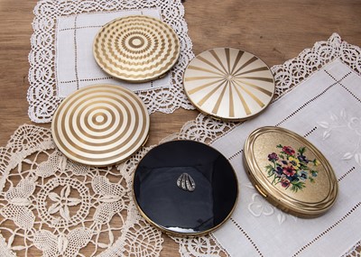 Lot 282 - Four large circular vintage gilt metal compacts