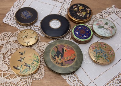 Lot 283 - A collection of nine Art Deco and later unmarked circular compacts