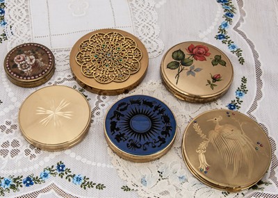 Lot 305 - Six circular gilt metal compacts