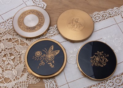 Lot 319 - Four large circular 1950s gilt metal compacts
