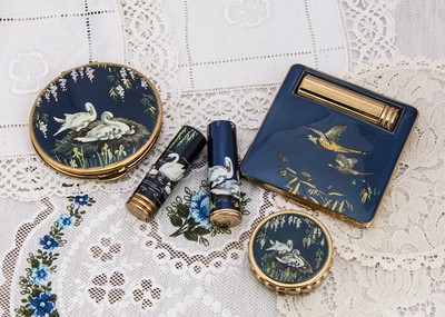 Lot 329 - Five Kigu gilt metal dark blue and bird decorated compacts