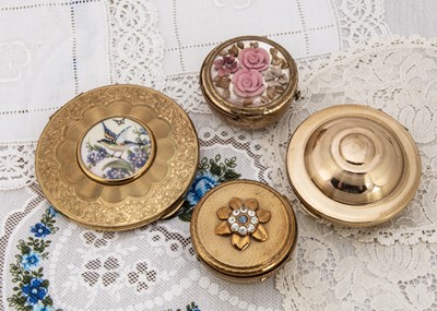 Lot 330 - Four 1950s gilt metal Kigu compacts