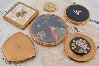 Lot 339 - A collection of gilt metal circular Mascot compacts
