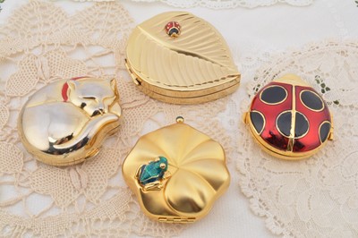 Lot 352 - Four contemporary novelty Estee Lauder compacts