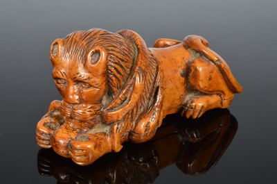 Lot 364 - A 19th century carved wooden lion snuff box
