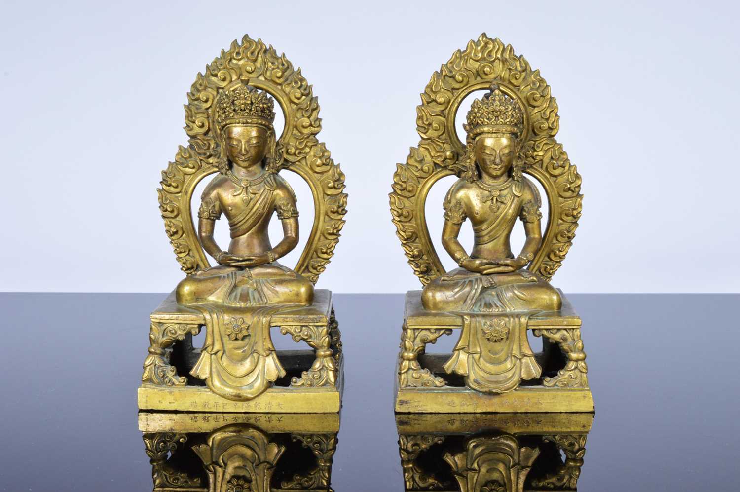 Lot 373 - A pair of antique Far Eastern gilt bronnze Buddhist figures