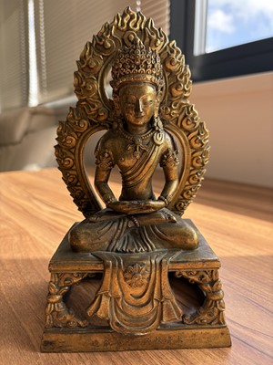 Lot 373 - A pair of antique Far Eastern gilt bronnze Buddhist figures
