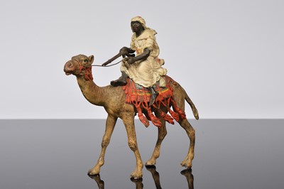 Lot 396 - A late 19th or early 20th century Viennese cold painted bronze camel and Arab rider after Franz Bergman