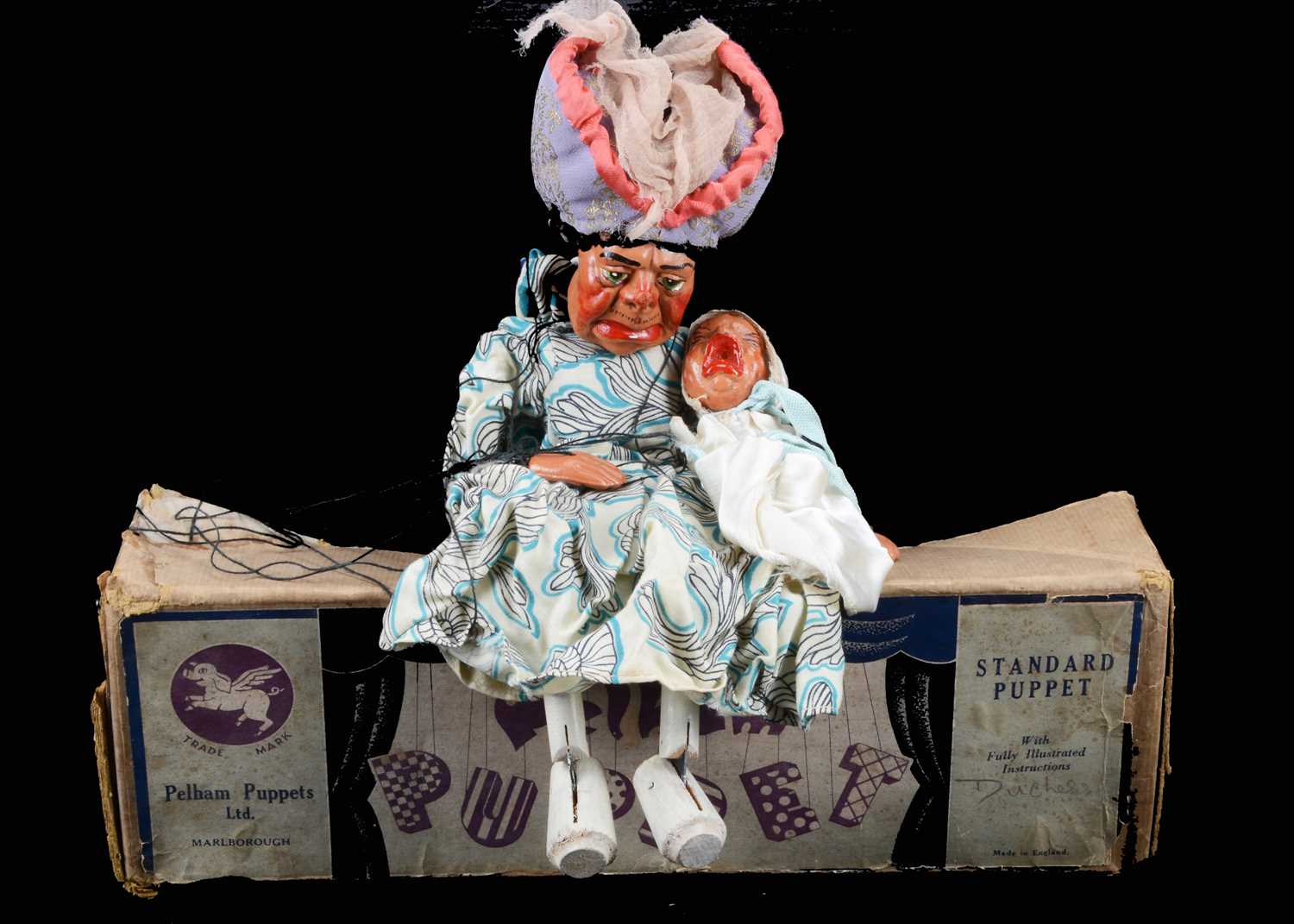 Lot 143 - A rare Pelham Puppet SL Duchess with Baby