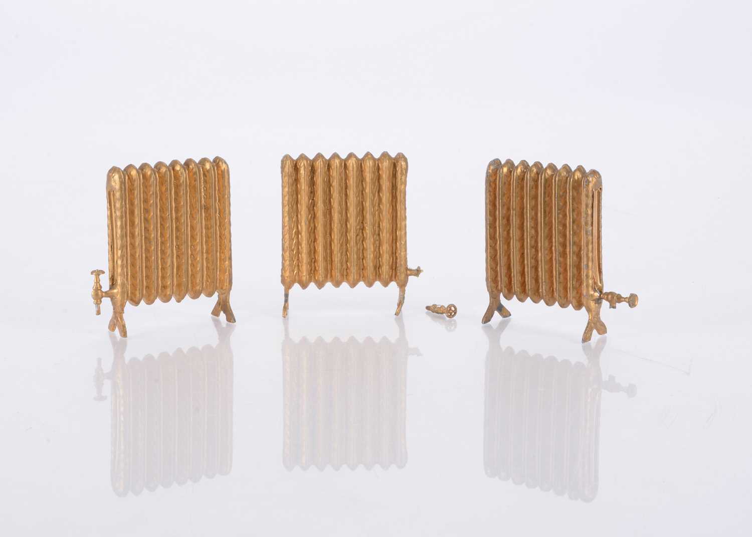 Lot 164 - Three German cast-lead dolls’ house radiators