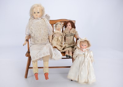Lot 236 - A late 19th century German papier-mâché shoulder-head doll
