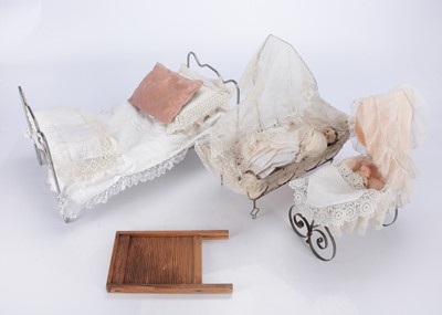 Lot 248 - An 19th century small metal cradle with drapes