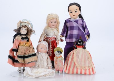 Lot 252 - An Asian tinted bisque head doll