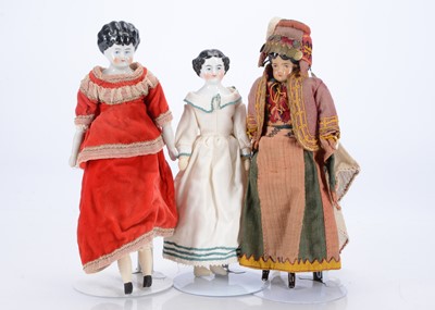 Lot 254 - An unusual brown tinted china shoulder-head doll